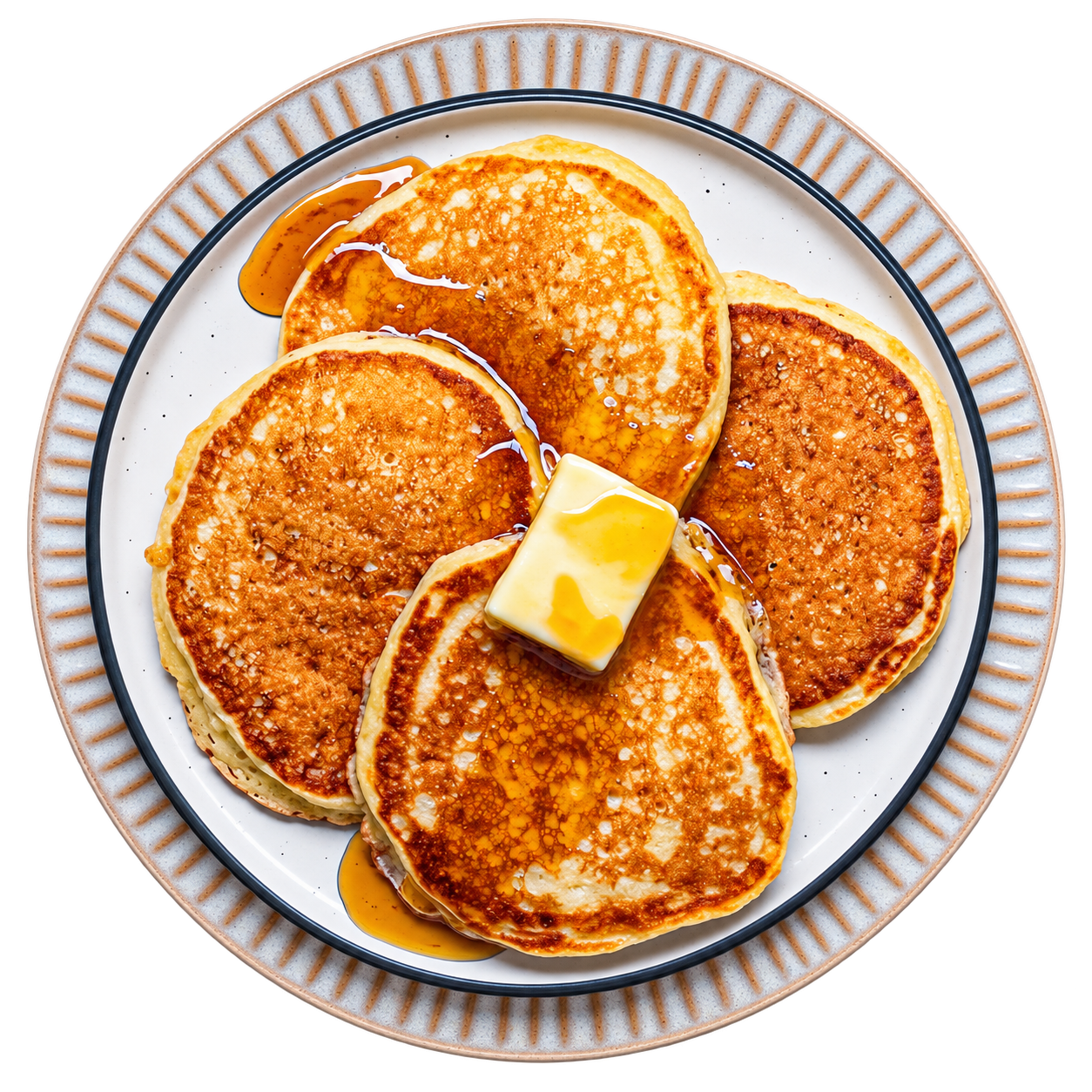 A plate of golden sourdough pancakes with butter and syrup