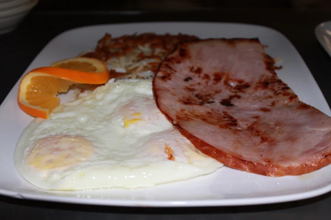 Country ham steak with eggs, hash browns and toast