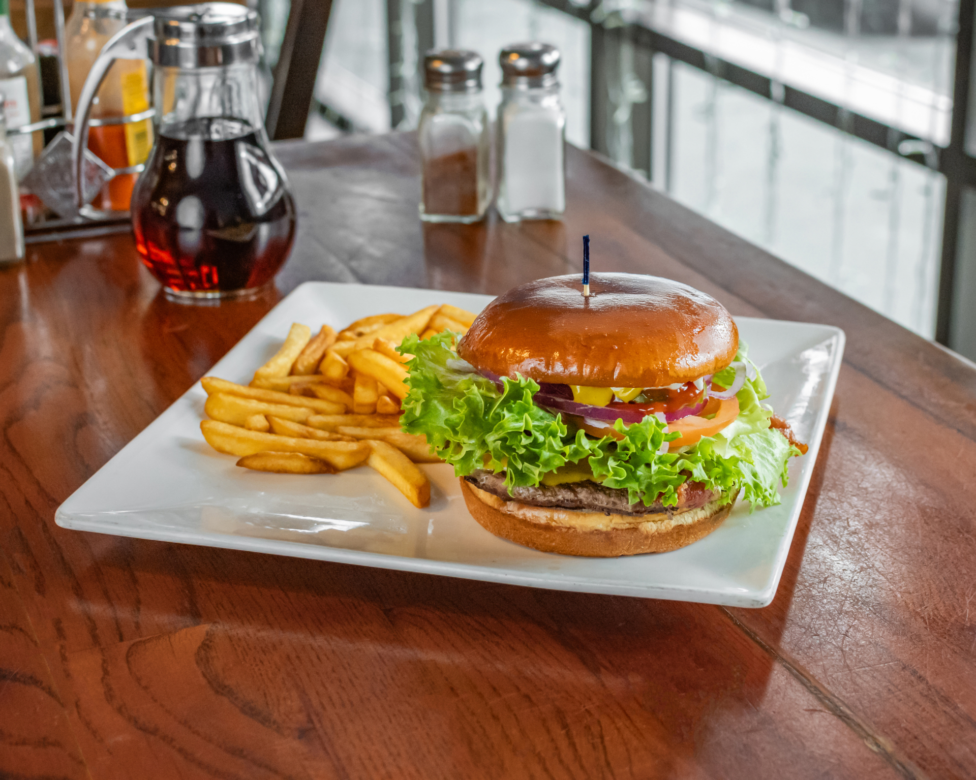 Fresh Harleyburger with lettuce, tomato, onion and a side of fries